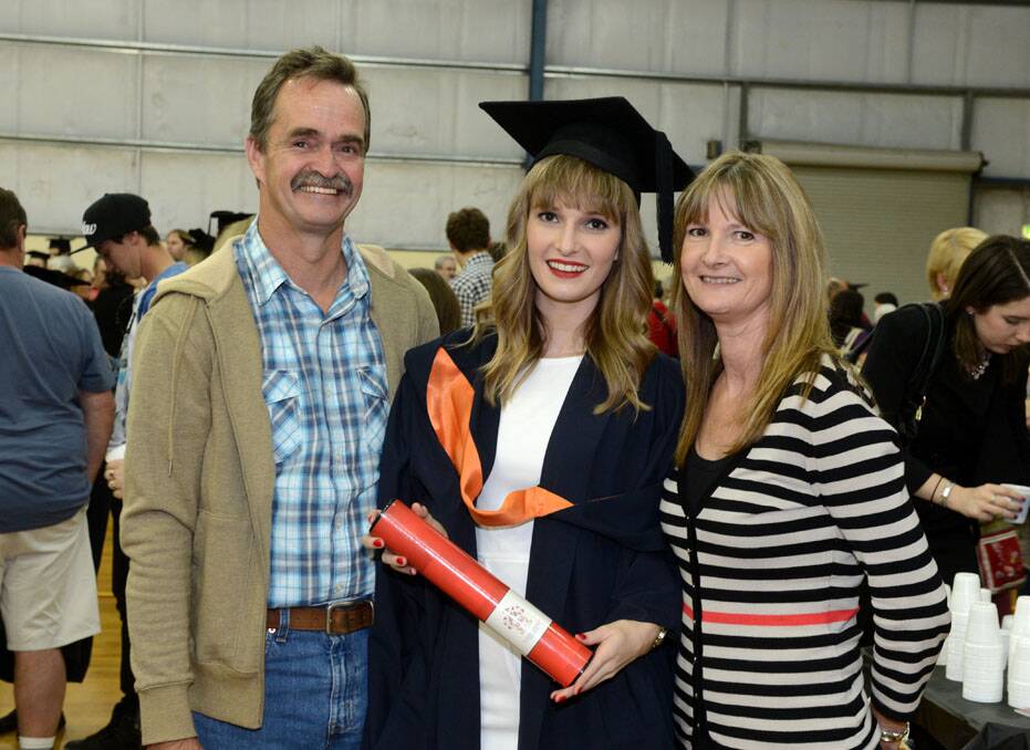 La Trobe University Bendigo graduation. Penny Holloway with her Bachelor of Business and parents Mark and Tracey Holloway. Picture: Jim Aldersey