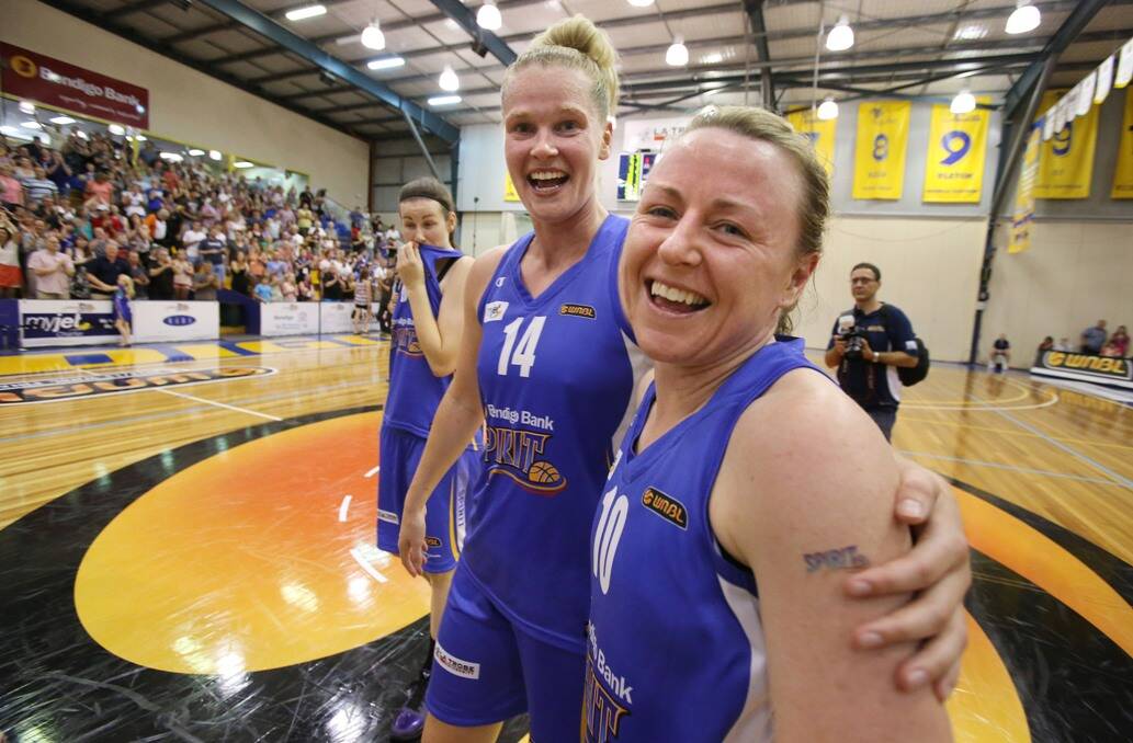 Spirit players Chelsea Aubry and Kristi Harrower celebrate after last night’s win over Dandenong.
