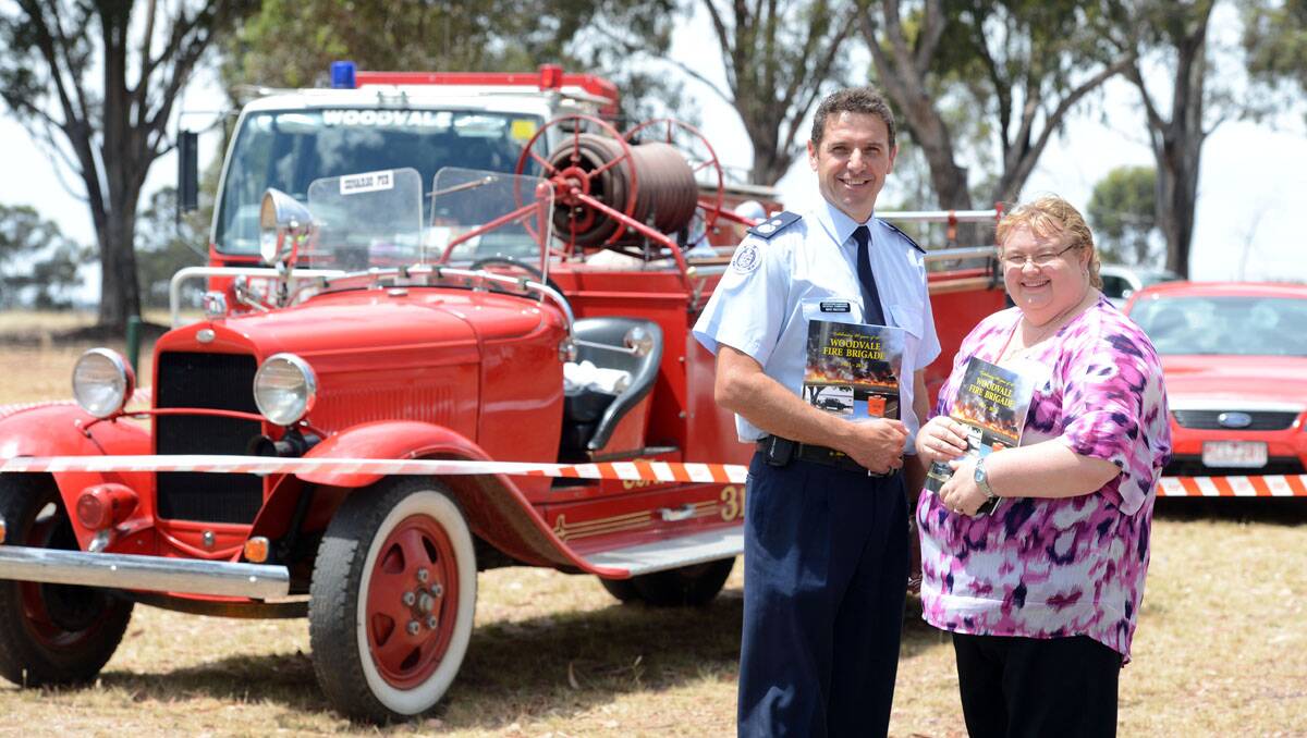 BOOK LAUNCH: CFA operations manager and regional commander Mike Wassing and author Helen Hickson with the book Celebrating 80 Years of the Woodvale Fire Brigade on Saturday. 
