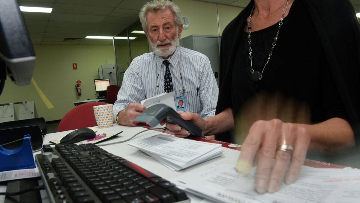 Bendigo Returning Officer Tony McDowell looks on as some of the council votes are sorted. Picture: Brendan McCarthy