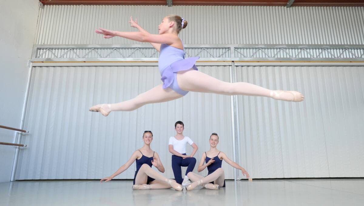 Brittany Wassing leaps through the air above Paige Davis, Ben Harris and Sarah Seery. Picture: Jodie Donnellan