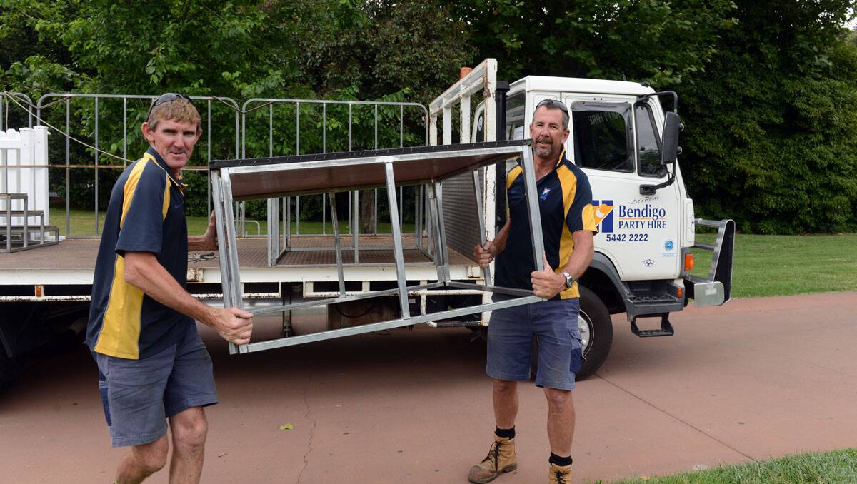 Glenn Leech and Alan Hudson from Bendigo Party Hire help get the stage ready. Picture: Peter Weaving
