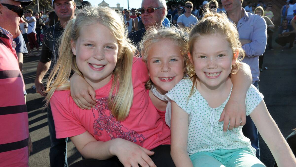 Faces at the BFNL grand final. Emily and Charlotte Strahan and Maggie Burke. Picture: Jim Aldersey