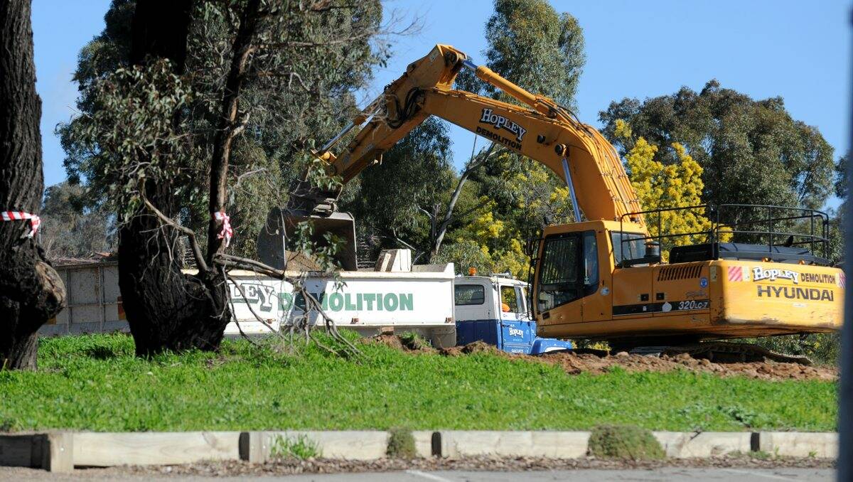 A Hopley Demolition truck removes rubbish from a school demolition site in Strathdale before transporting it to its recycling site. Picture: Bendigo Advertiser