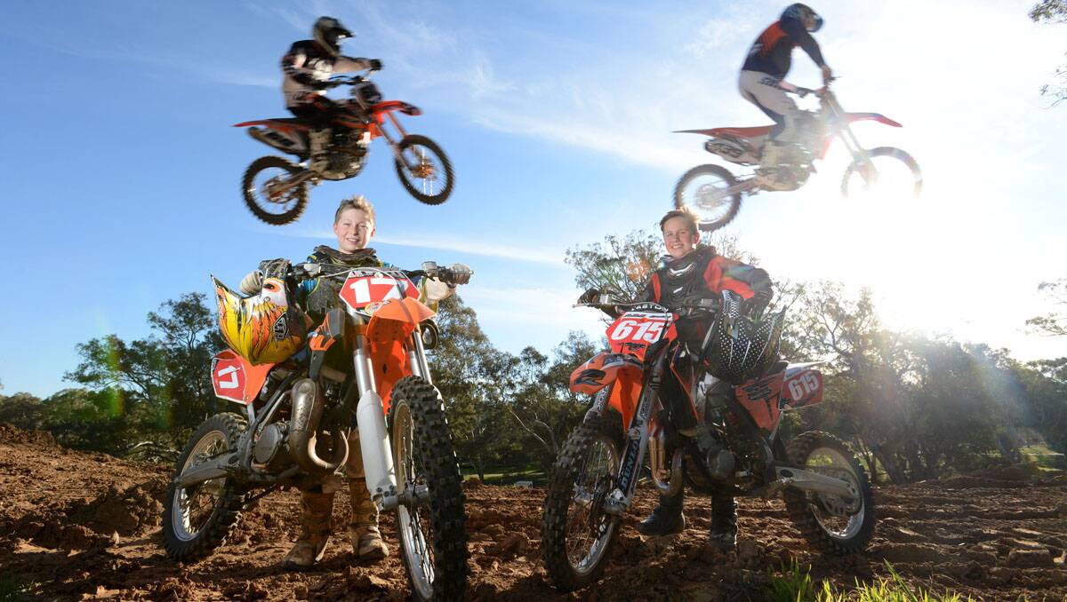 Jake Pfeiffer and Max Stewart with their bikes while Craig Rutherford and Brett Hazeldene jump the tabletop ahead of the Ravenswood cup   Picture: Jim Aldersey