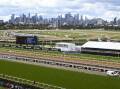 The flood wall at Flemington Racecourse has been criticised in a report following flooding in 2022. (James Ross/AAP PHOTOS)