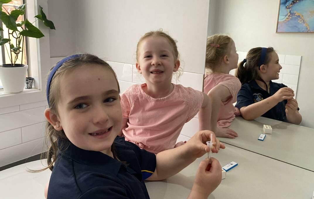Central Victorian parent Rachael Orel's daughters Elena and Freya self testing themselves. Picture: SUPPLIED