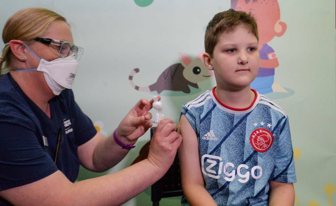 Seven-year-old Tobias Streeg received his COVID-19 vaccination at the Bendigo Vaccination Hub.Picture: DARREN HOWE