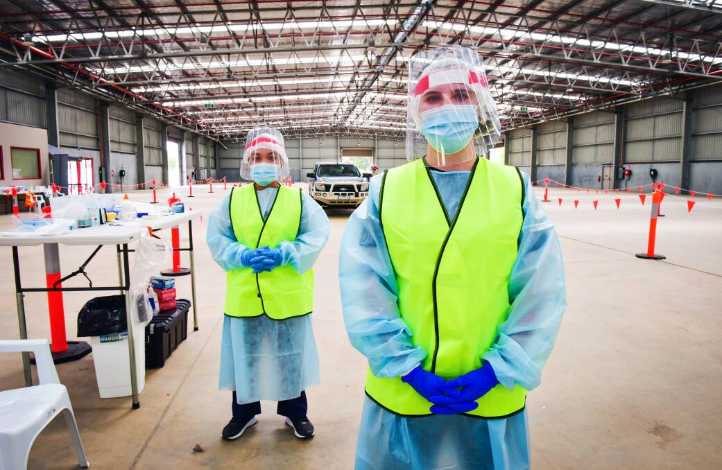 Nurses Chelsea Lasin and Erin Donnelly at the COVID-19 testing centre, Bendigo Showgrounds. Photo: Brendan McCarthy