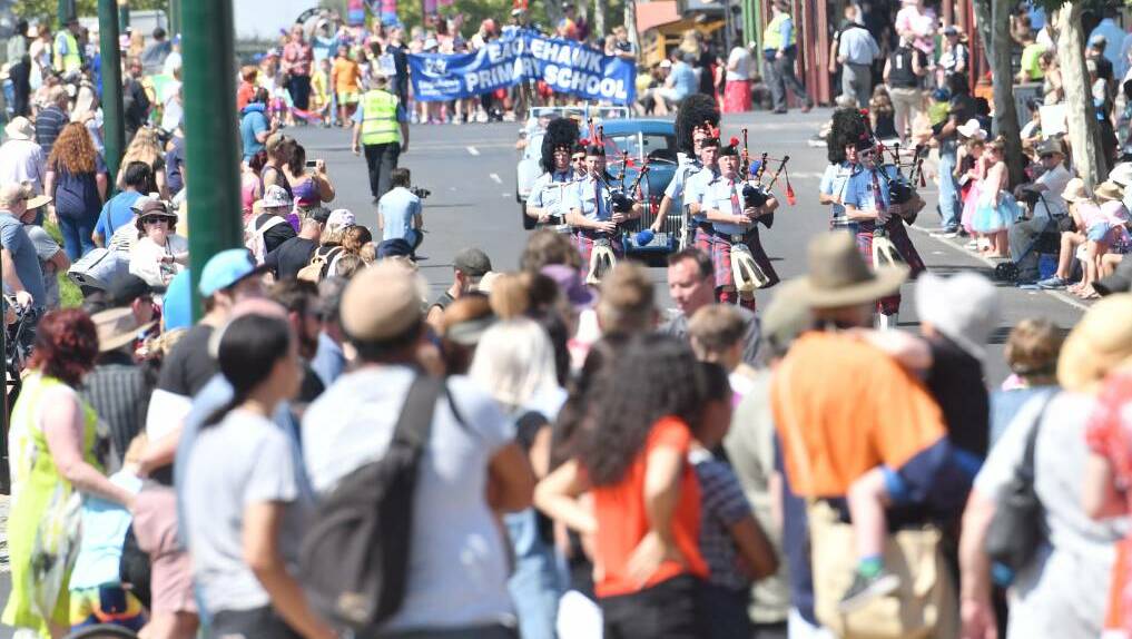Crowds watch an Eaglehawk street parade during the Dahlia and Arts Festival in 2019. Picture: DARREN HOWE 