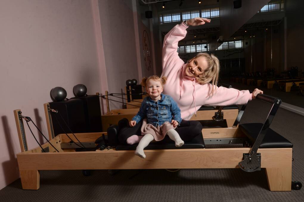 Stacey Cossar, with her daughter Elsie, has discovered her passion for Pilates. Pictures: DARREN HOWE