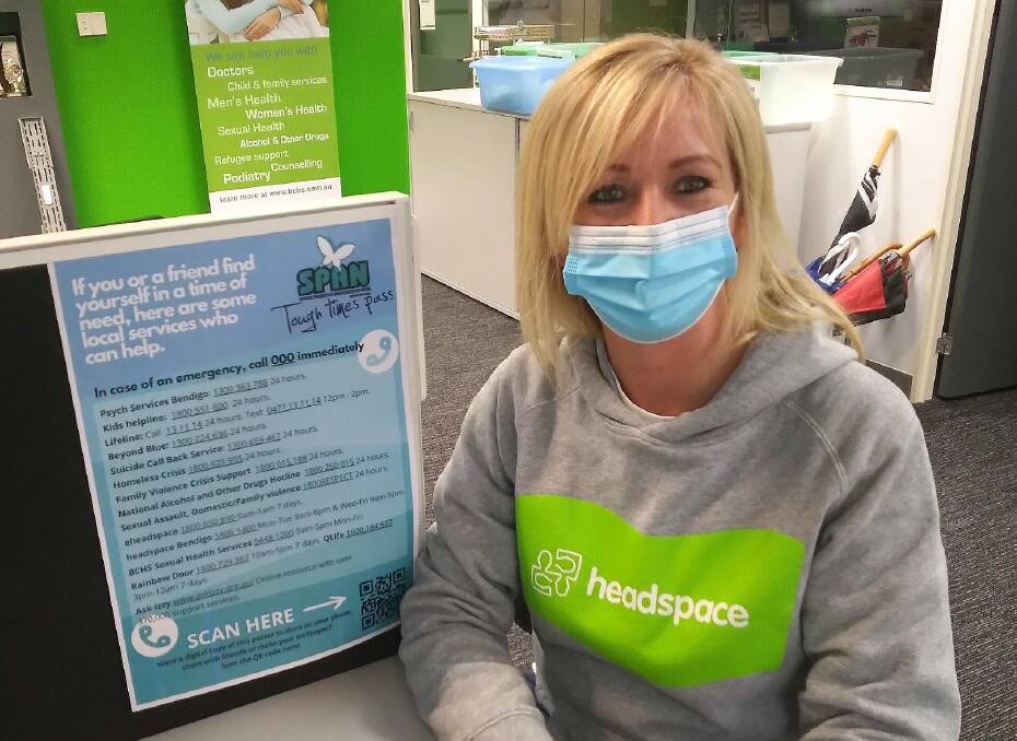 Headspace Bendigo Community Awareness Officer Haylee Kennedy with the Youth Crisis Card poster. Picture: SUPPLIED