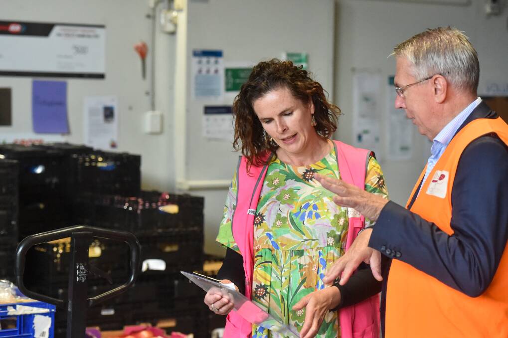 GROWTH: Nationals leader Peter Walsh visits Bendigo Foodshare to chat with manager Bridget Bentley about their new facility and growth in the future. Picture: DARREN HOWE