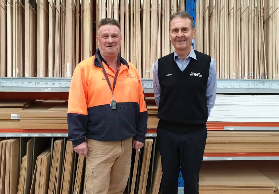 CLOCKING OFF: Geoff Plowright (left) retires after 52 years of service at Hume & Iser Mitre 10. Managing director Stephen Iser (right) said Geoff will be sorely missed. Picture: SUPPLIED