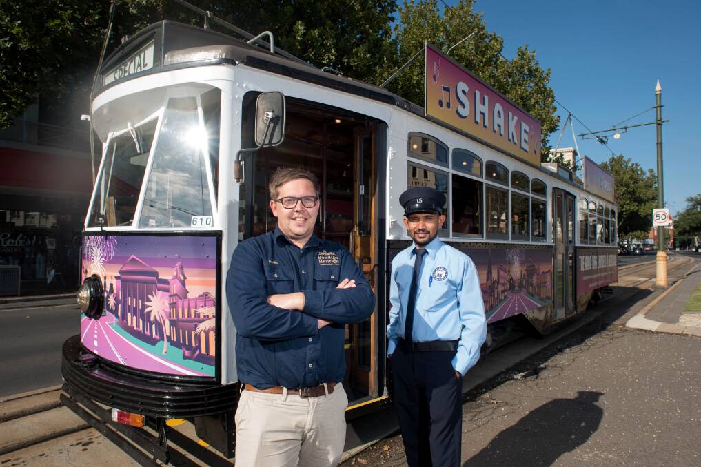 Bendigo heritage Attractions chief executive James Reade and tram driver Sammy Pushpakumara at the Shake Rattle & Roll tram, Bendigo. Picture: Brendan McCarthy