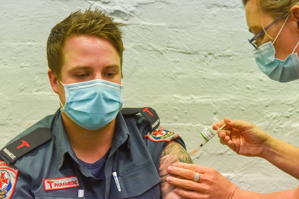 JAB: Ambulance Victoria paramedic Josh Wiltshire received his second dose of the COVID-19 vaccine back in June. Picture: DARREN HOWE