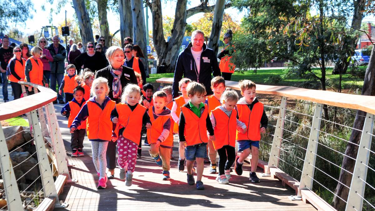 JUMPING FOR JOY: Kangaroo Flat kindergarten students join Mayor Jennifer Alden at Wednesday's official opening. Picture: Brendan McCarthy