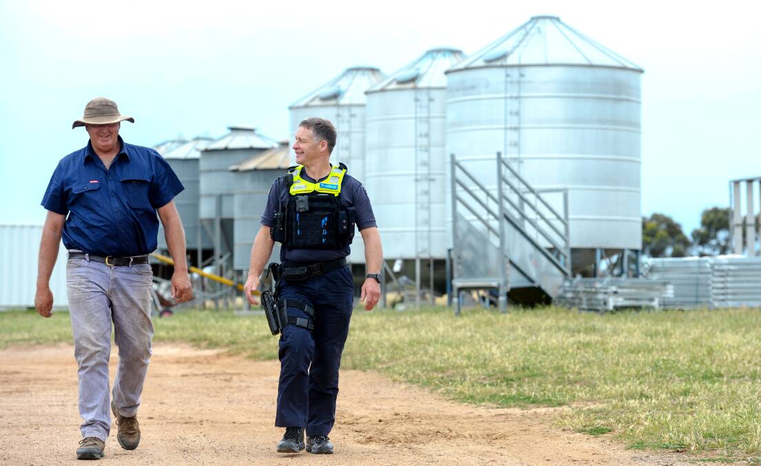 Farm Crime Liaison Officer Leading Senior Constable Dan O'Bree with farmer Tim Harrington. Picture: DARREN HOWE