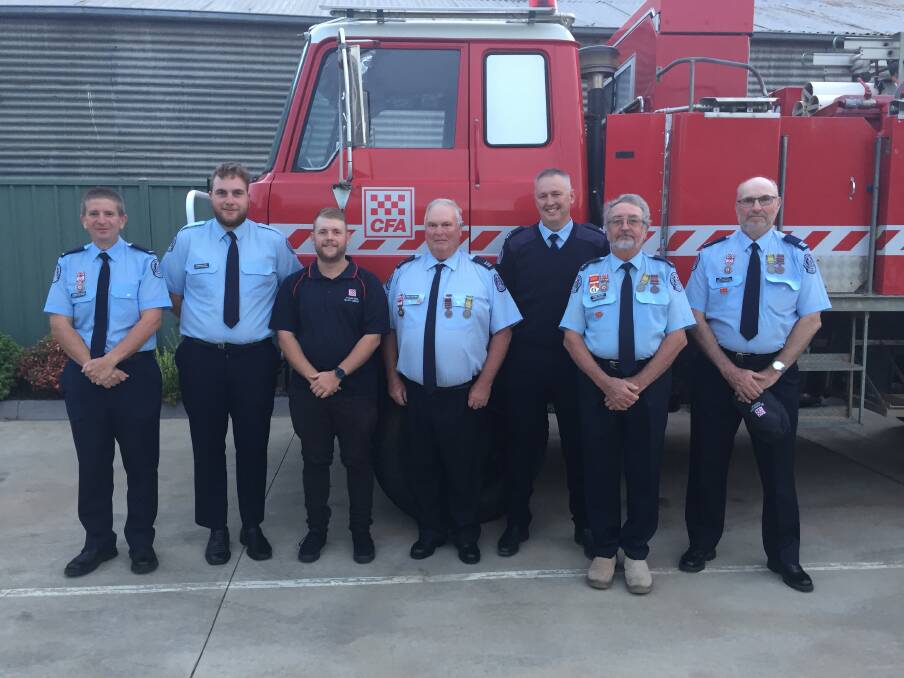 St Arnaud CFA Brigade, including Deputy Group Officer Craig Cheesman (middle) who was saved using a CFA defibrillator when his heart stopped during a group training exercise three years ago. This photo was taken three years ago. 