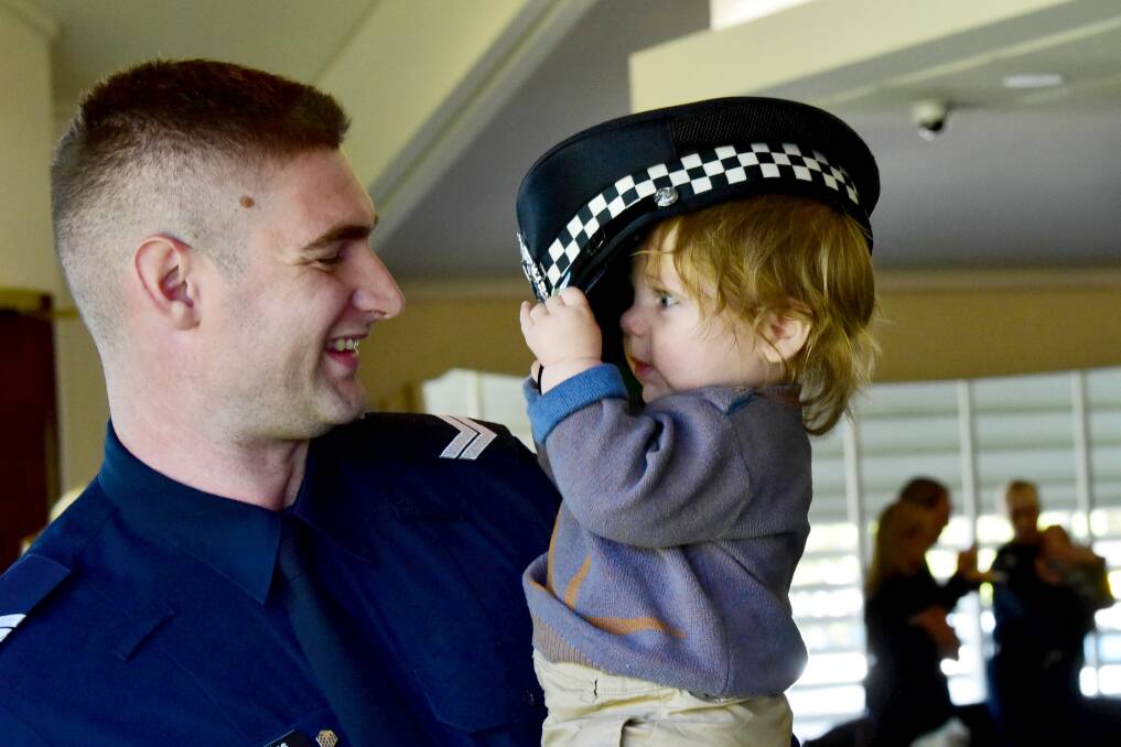 Senior Constable Rohan De Wys and his son Noah. Picture: Brendan McCarthy