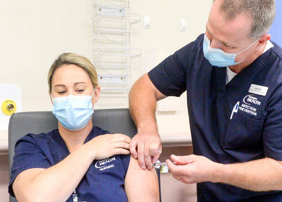 MILESTONE: Nicole Harper received the first COVID-19 vaccine at Bendigo's vaccination hub in March. Bendigo Health has now reached a huge milestone. Picture: DARREN HOWE