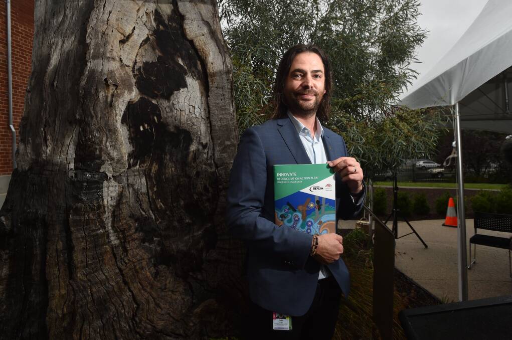 Bendigo Health Aboriginal Services manager Dave Kerr with the new reconciliation action plan. Picture: NONI HYETT