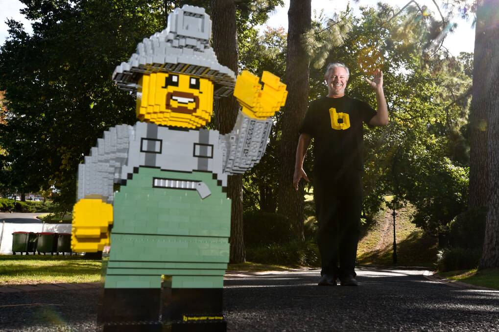 BUILD: Bendigo LEGO User Group mascot Doug and LEGO ambassador Michael Peebles. Picture: NONI HYETT