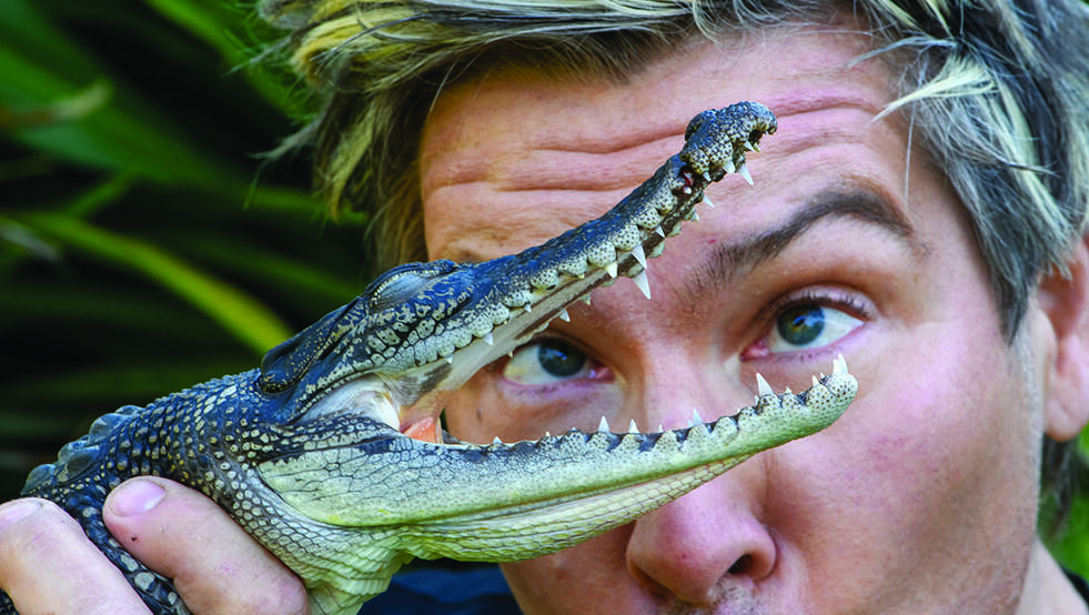 Chris Humfrey with a crocodile. Pictures: SUPPLIED