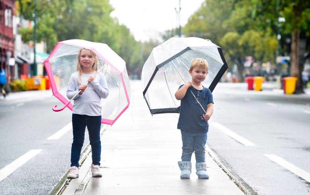 MORE WET WEATHER: Acacia and Ryan Staley after the Bendigo Easter Fair parade was cancelled back in April. Picture: NONI HYETT