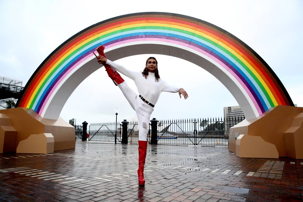 Jack Williams in front of the Big Rainbow at its temporary home in Sydney. Picture supplied