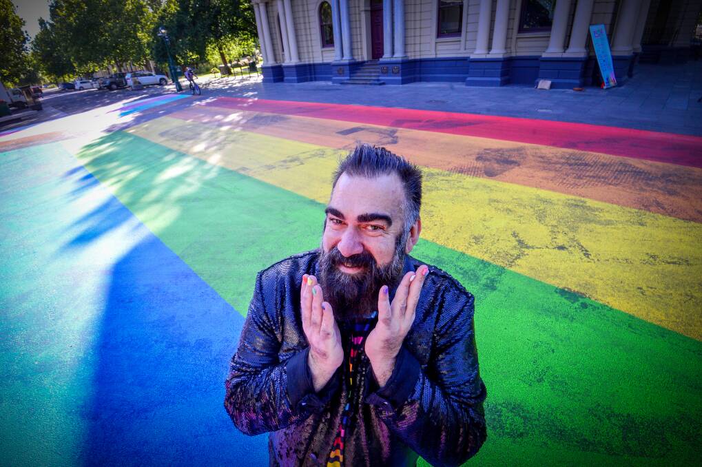 Bendigo Pride Festival director John Richards with the new mural. Picture: DARREN HOWE