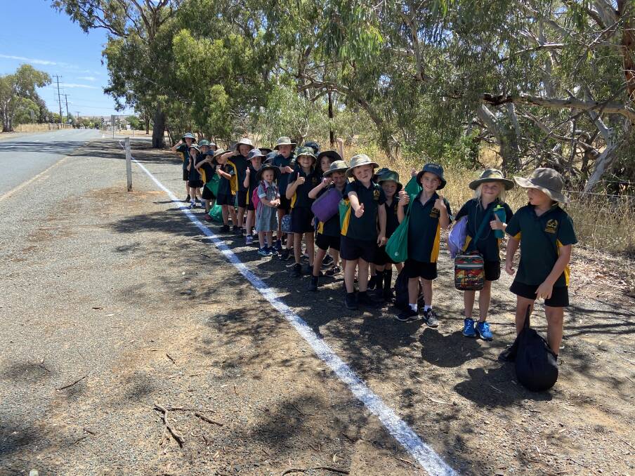 SAFETY FIRST: Colbinabbin Primary School students along the lines staff put beside the busy Bendigo-Murchison Road. Picture: SUPPLIED