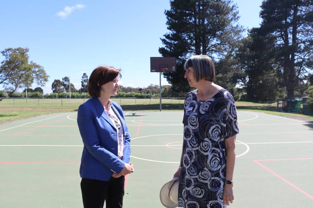 Member for Macedon Mary-Anne Thomas with principal Leeanne Macdonald on the basketball court play area receiving an upgrade. Picture: SUPPLIED 