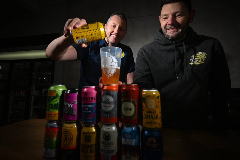 DRINK AND DONATE: Bendigo Beer president Trevor Birks and Scott Toll. Picture: DARREN HOWE