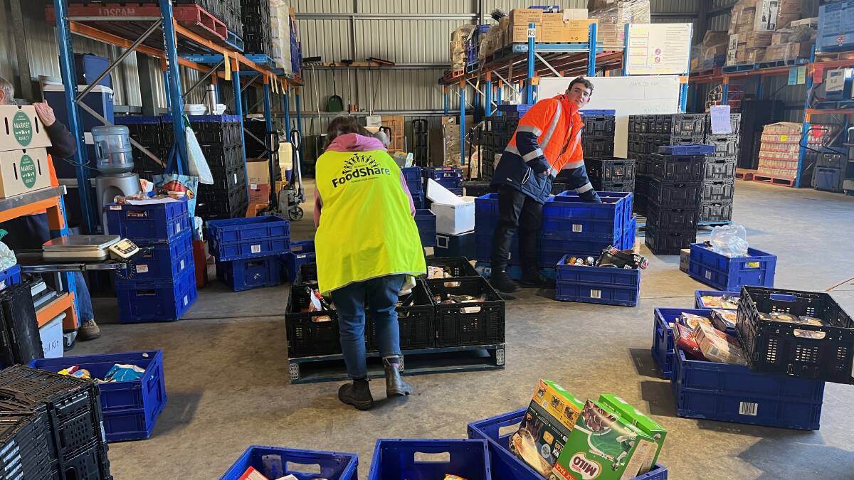 GENEROUS: Bendigo Foodshare volunteers unpacking the thousands of donations they received during the month of June. Picture: SUPPLIED