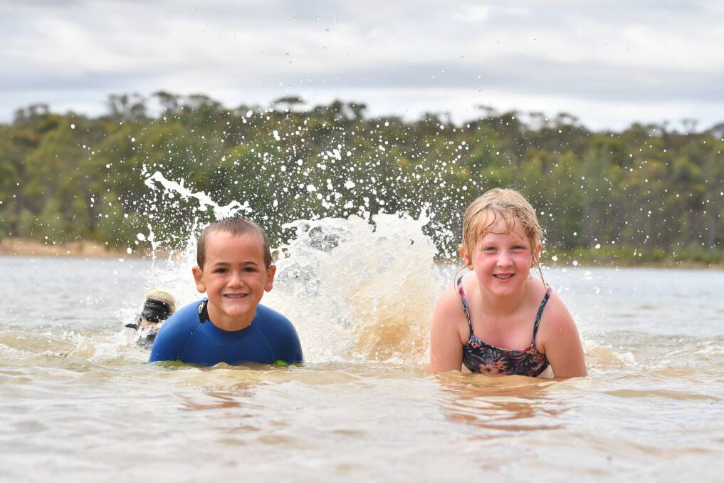 Banjo Place and Samantha Perry making a splash at Crusoe Reservoir. Picture: NONI HYETT