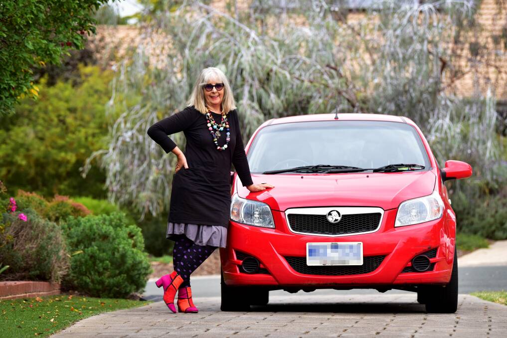 BEEP BEEP: Brenda Stevens-Chambers with the Holden Barina her and her husband Charles are donating to a family in NSW. Picture: BRENDAN McCARTHY