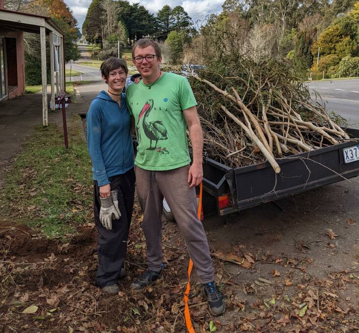CLEAN-UP CREW: Locals Kate Mooney and John Dorsett are helping clear up the Trentham roads. Picture: Tarnay Sass