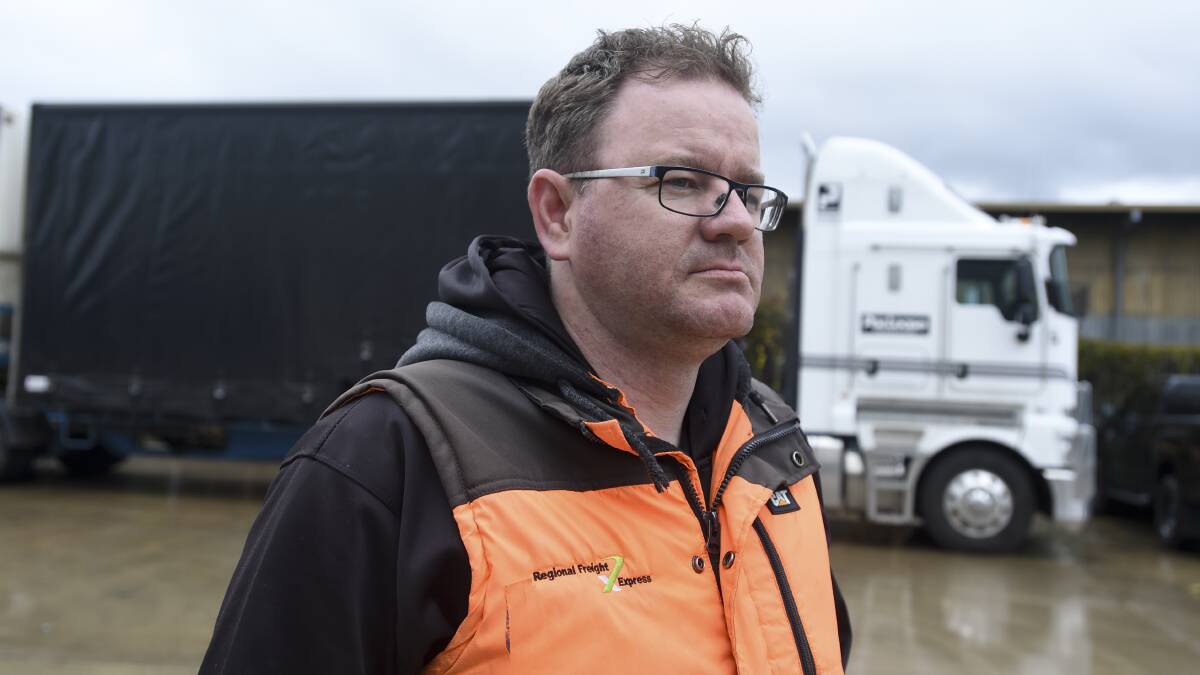Regional Freight Express driver Michael Brown and his workmates are bracing for the return of the full fuel excise tax this week. Picture by NONI HYETT