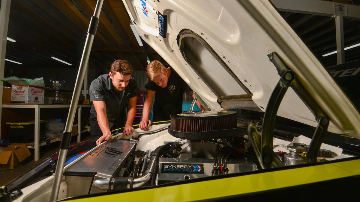 Bendigo mechanics Harry Mustey (left) and Will Beasy were key elements in helping John Bowe's 1977 Torana claim the Touring Car Masters title at Bathurst last week. Picture: DARREN HOWE
