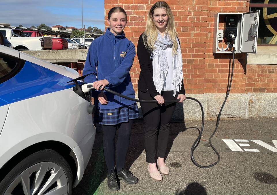 FILL IT UP: Year 9 student Della Czuczman and RACV Solar marketing specialist Zoe Duggan charge up a vehicle at the Discovery centre. 