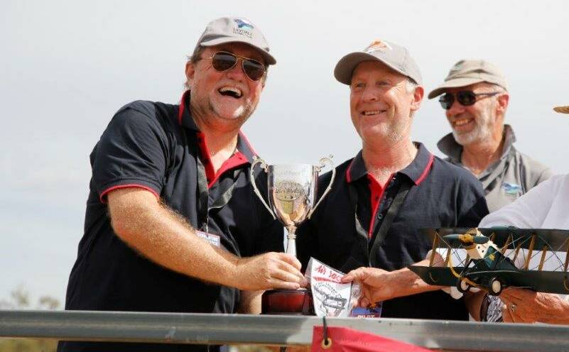 CUP WINNERS: Graham Bunn and Murray Gerraty with the cup after winning the 2022 Serpentine Air Race at the centenary celebrations of Australia's first official air race. 