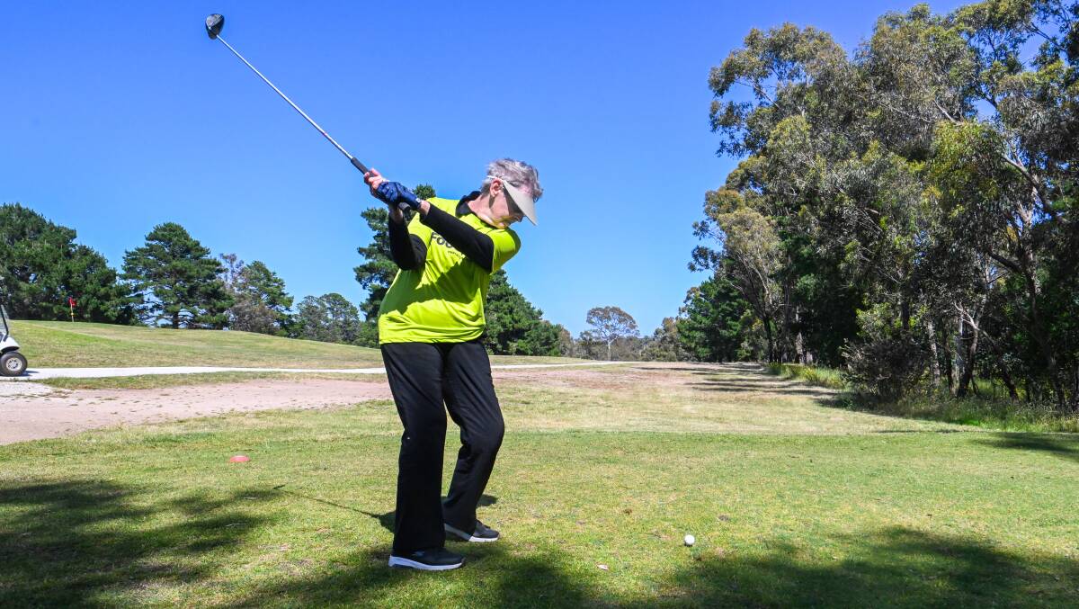 Jeanette Jackson from Foodshare tees off at the Bendigo Toyota Golf Day at Belvoir Golf Club on Friday. Picture by DARREN HOWE