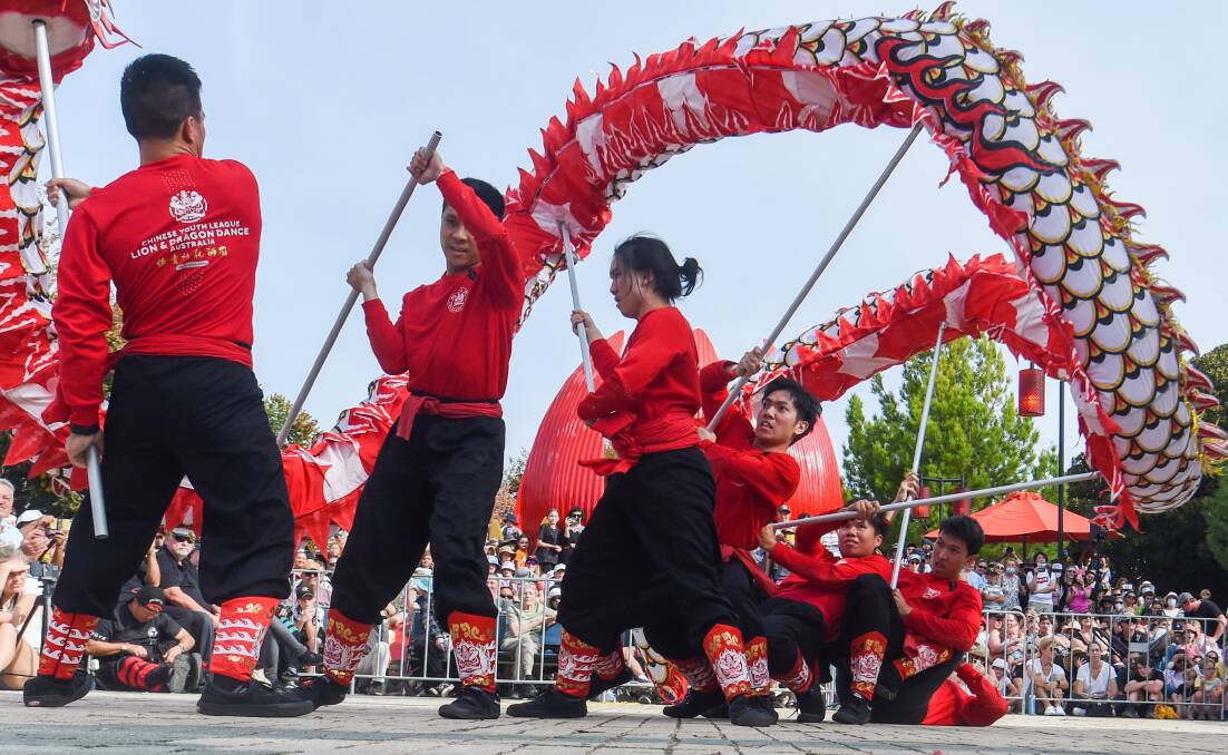 COLOURFUL: Chinese association dancers perform for the crowd. Picture: DARREN HOWE