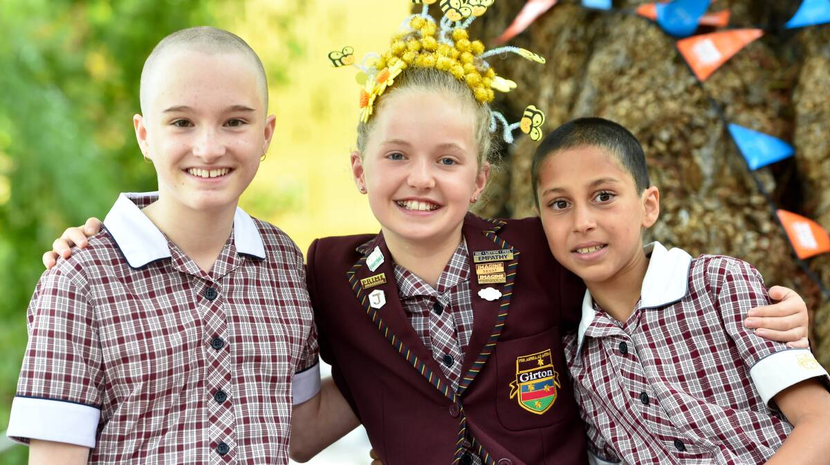 CLOSE SHAVE: Girton Grammar Junior School students Charlotte Thomson, Sium O'Malley and Hazel Ziffer at the World's Greatest Shave. Picture: NONI HYETT