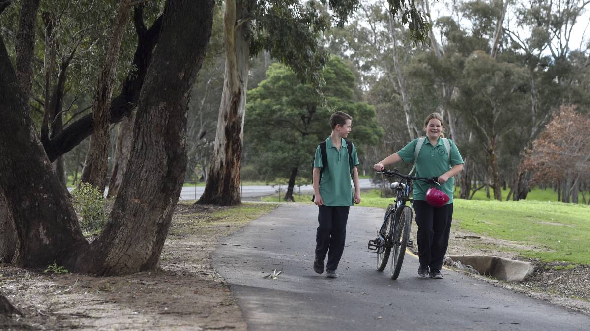 PLEASURE TO WALK: St Francis of the Fields Primary School students Tate Kanzamar and Aysha O'Kane use the recently sealed footpath in Strathfieldsaye community. Picture: NONI HYETT