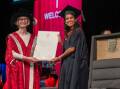 Deputy Chancellor Margaret Burdeu presents Dinali Shaeron Dharmadasa with her certificate at the graduation ceremony. Picture by Enzo Tomasiello