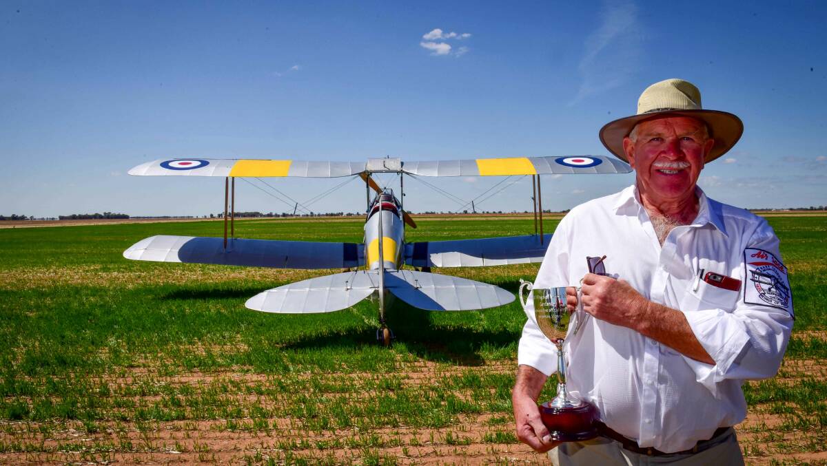 Serpentine pilot Richard Evans who flew in the 1995 race with the cup for this year's race. Picture: BRENDAN McCarthy