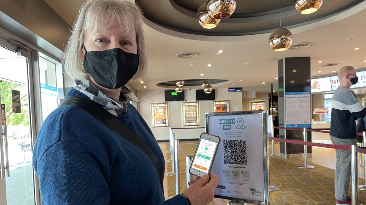 Heather Smith earns the tick of approval for being fully vaccinated to attend the Bendigo Cinemas as part of the vaccine economy trial.