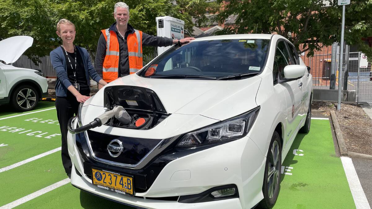 City of Greater Bendigo climate change and environment manager Michelle Wyatt and fleet manager Luke Shaw fill up a staff vehicle at the new charging station. Picture: DAVID CHAPMAN